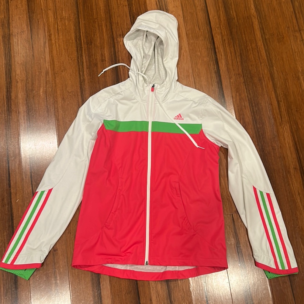 Women’s Adidas lightweight zippered jacket with thumb holes. Size M, new w/o tag